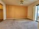 Spacious bedroom with carpet flooring and sliding glass door to balcony at 1904 Las Palmas Ln # 101, Laughlin, NV 89029