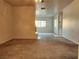 Bright living room features carpet, fireplace and access to other rooms at 1904 Las Palmas Ln # 101, Laughlin, NV 89029