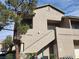 Tan colored building exterior with stairs at 2052 Jade Creek St # 202, Las Vegas, NV 89117