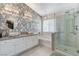 Spa-like bathroom with double sinks, soaking tub and walk-in shower at 2121 Crestline Falls Pl, Las Vegas, NV 89134