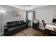 Home office featuring a black leather sofa and a workspace at 2121 Crestline Falls Pl, Las Vegas, NV 89134