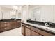 Primary bathroom with dual vanity and dark countertops at 2388 Dalewood Ave, North Las Vegas, NV 89086