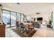 Open dining room with a table and chairs near the living room at 2388 Dalewood Ave, North Las Vegas, NV 89086