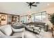 Comfortable living room with gray sofas and a ceiling fan at 2388 Dalewood Ave, North Las Vegas, NV 89086