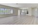 Open concept living room with kitchen and vinyl plank floors at 2600 Memphis Ave, Henderson, NV 89052