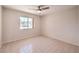 Well-lit bedroom with tile floors and a window at 2816 Bent Tree Ct, Las Vegas, NV 89134