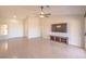 Bright living room with tile floors, a ceiling fan, and a large TV at 2816 Bent Tree Ct, Las Vegas, NV 89134