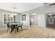 Bright dining room with hardwood floors, round table, and gray chairs at 3181 Asoleado Cir, Las Vegas, NV 89121