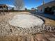 A serene outdoor space features a designated area for a potential fire pit or garden feature at 390 China St, Pahrump, NV 89048