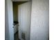 Exterior bathroom access featuring a tiled floor, granite countertop, and a convenient dog door at 390 China St, Pahrump, NV 89048