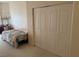Bedroom featuring a closet and carpeted floors at 390 China St, Pahrump, NV 89048
