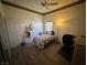 Bedroom with a bed, a corner desk, and a dark laminate floor at 390 China St, Pahrump, NV 89048