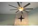 Stylish ceiling fan above a fireplace, offering modern comfort and design at 390 China St, Pahrump, NV 89048