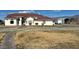 House exterior showcasing a large front yard and walkway at 390 China St, Pahrump, NV 89048