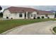 A charming single-story home with stucco exterior, tile roof, and well-manicured lawn at 390 China St, Pahrump, NV 89048