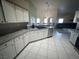 Bright kitchen with plenty of counter space and white cabinets for easy organization at 390 China St, Pahrump, NV 89048