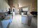 Spacious kitchen with granite countertops and modern appliances offers a functional design at 390 China St, Pahrump, NV 89048