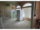 Bright living room with arched windows and comfortable seating is perfect for relaxing at 390 China St, Pahrump, NV 89048