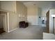 Open living room boasts high ceilings and neutral carpeting for versatile decorating at 390 China St, Pahrump, NV 89048