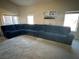 Comfortable living room with a large sectional sofa, perfect for relaxing and entertaining guests at 390 China St, Pahrump, NV 89048