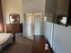 Main bedroom features a comfortable bed, dresser, and private outdoor access at 390 China St, Pahrump, NV 89048