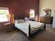 Spacious main bedroom featuring a comfortable bed, side tables, and a dresser with ample natural light at 390 China St, Pahrump, NV 89048