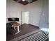 Home office space features a ceiling fan, and a desk with a monitor by the window at 390 China St, Pahrump, NV 89048