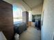 Cozy covered patio featuring a wood wall, an outdoor kitchen, and a gas barbeque at 390 China St, Pahrump, NV 89048