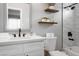 Updated bathroom with white vanity and marble-look tile at 461 S Chesapeake Way, Henderson, NV 89015