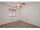 Simple bedroom with ceiling fan and neutral carpeting at 5012 Camino Del Rancho, Las Vegas, NV 89130