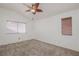 Bedroom with vaulted ceiling, ceiling fan, and neutral carpeting at 5012 Camino Del Rancho, Las Vegas, NV 89130