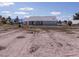 Large lot with single-story house in the distance at 5271 Deanna St, Pahrump, NV 89048