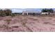 House and large desert lot with sparse vegetation at 5271 Deanna St, Pahrump, NV 89048