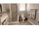 Clean bathroom with a shower, toilet and updated vanity at 5271 Deanna St, Pahrump, NV 89048