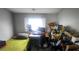 Small bedroom with a bed, desk, and storage at 5271 Deanna St, Pahrump, NV 89048