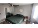 Green bedroom with mirrored closet doors at 5271 Deanna St, Pahrump, NV 89048