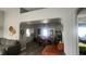 Bright dining room adjacent to kitchen, featuring wooden table and chairs at 5271 Deanna St, Pahrump, NV 89048