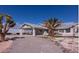 Single-story house with carport, palm tree, and gravel driveway at 5271 Deanna St, Pahrump, NV 89048