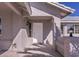 White front door entry with sidelights and light fixture at 5271 Deanna St, Pahrump, NV 89048