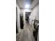 Bright hallway with wood-look flooring and stylish decor at 5271 Deanna St, Pahrump, NV 89048