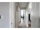 Bright hallway with light gray walls and wood-look floors at 5271 Deanna St, Pahrump, NV 89048