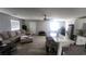 Open living room with sectional sofa and kitchen island at 5271 Deanna St, Pahrump, NV 89048