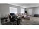 Living room with sectional sofa and workspace at 5271 Deanna St, Pahrump, NV 89048