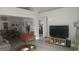 Open living area with dining space, large TV, and comfortable seating at 5271 Deanna St, Pahrump, NV 89048