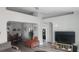 Open living area with dining space, large TV, and comfortable seating at 5271 Deanna St, Pahrump, NV 89048