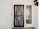 Ornate front door with security screen at 5436 Red Sun Dr, Las Vegas, NV 89149