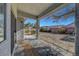 Covered patio offering a peaceful outdoor space with views of the spacious, landscaped backyard at 5919 Pavilion Lakes Ave, Las Vegas, NV 89122