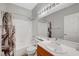 Bathroom featuring a shower-tub combination, vanity with sink, and neutral decor at 5919 Pavilion Lakes Ave, Las Vegas, NV 89122