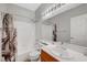 Well-lit bathroom boasts a shower-tub combo and single sink vanity with storage at 5919 Pavilion Lakes Ave, Las Vegas, NV 89122