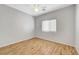 Bedroom with wood-look flooring and a ceiling fan at 5919 Pavilion Lakes Ave, Las Vegas, NV 89122